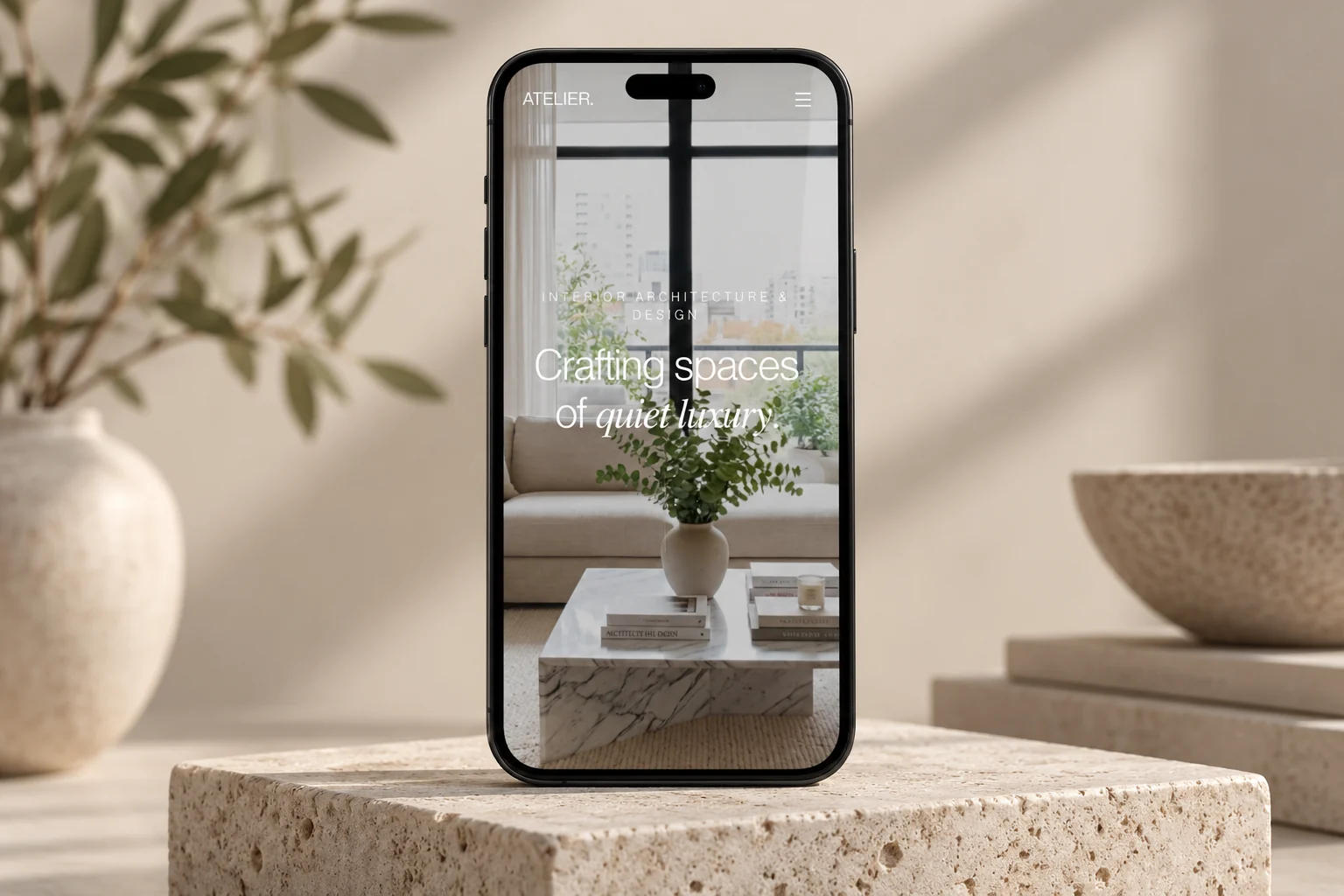 Studio Atelier mobile editorial concept on a smartphone.